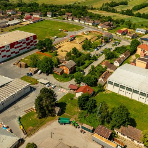 Aerial photograph of an industrial area in Hercegovac, Croatia, with rural surroundings.