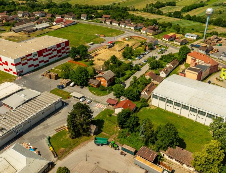 Aerial photograph of an industrial area in Hercegovac, Croatia, with rural surroundings.