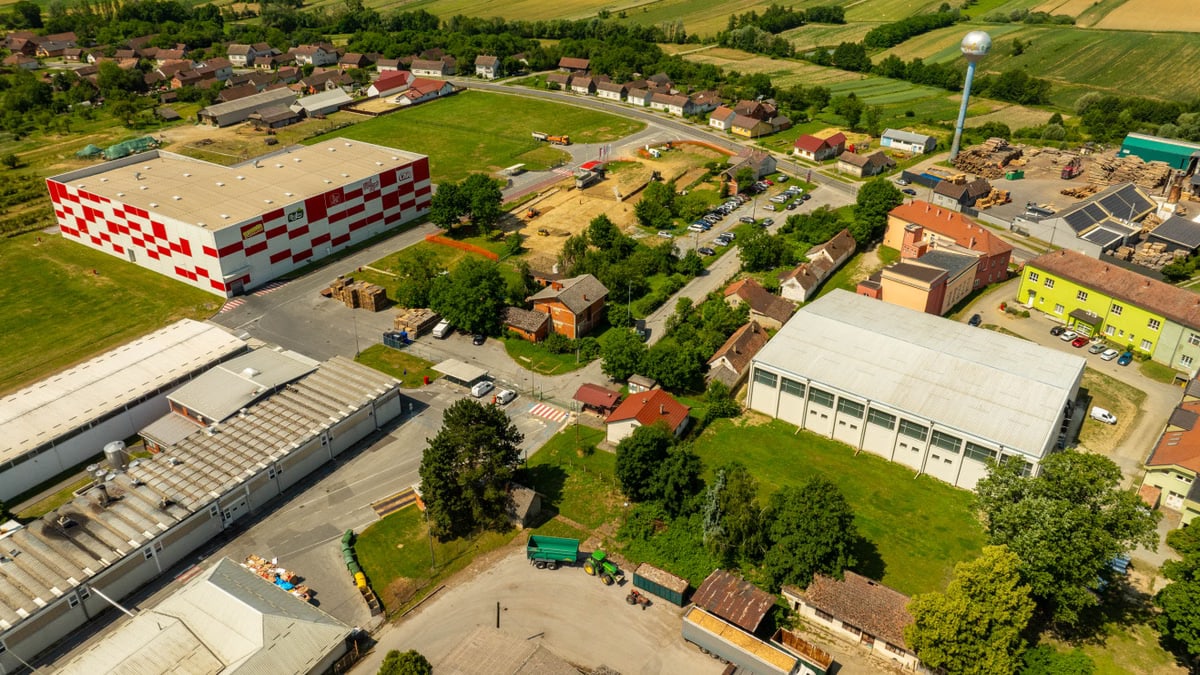 Aerial photograph of an industrial area in Hercegovac, Croatia, with rural surroundings.